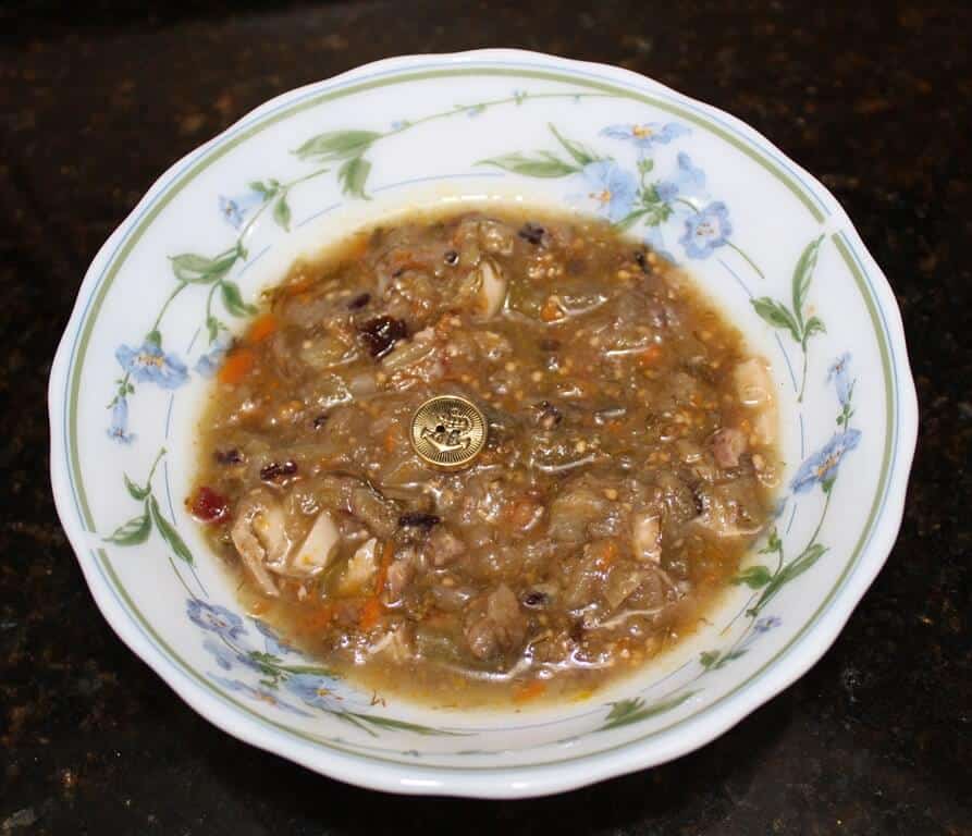 Button in a plate of soup