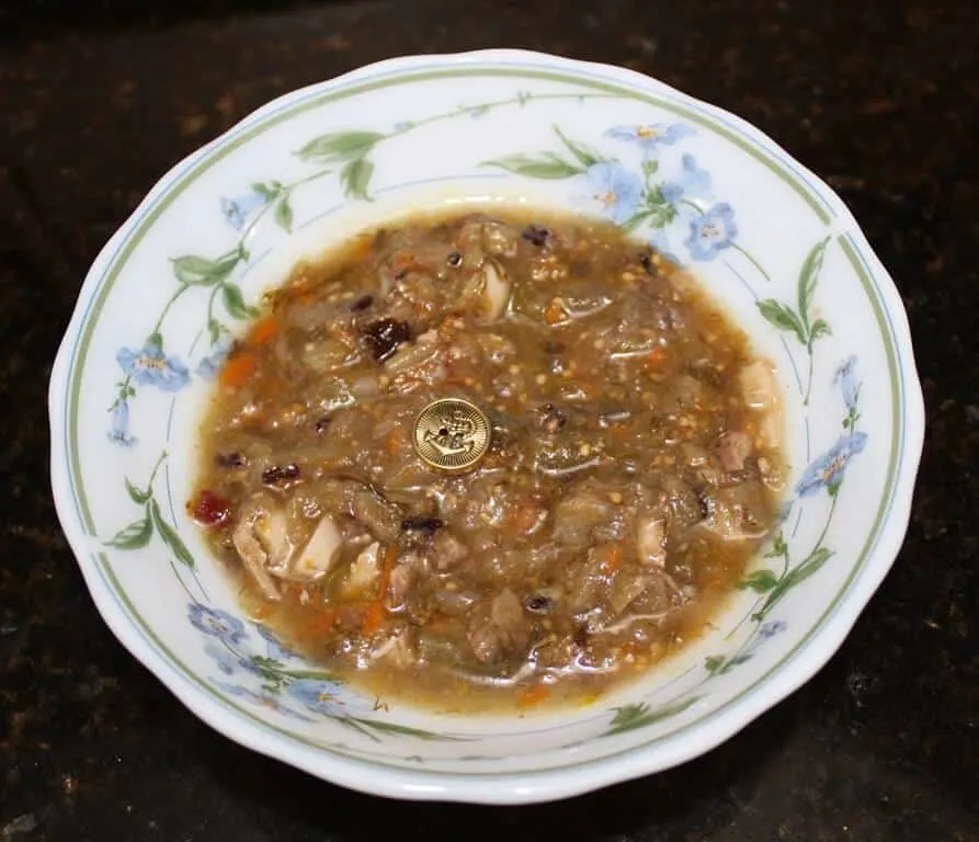 Button in a plate of soup