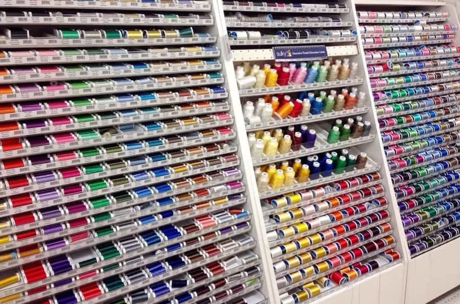 sewing threads in a fabric store on racks