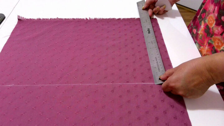 measuring fabric with a ruler for cutting fabric straight