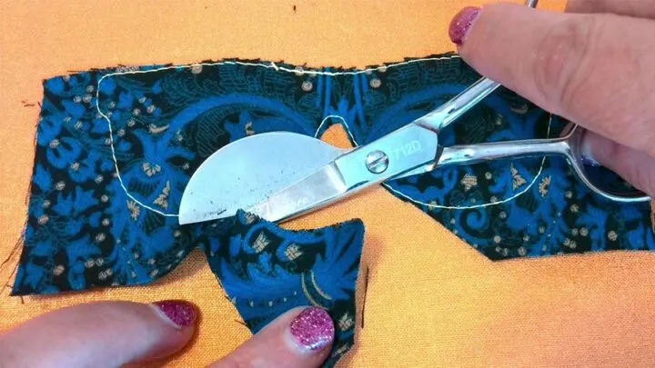 cutting an applique with duckbill scissors