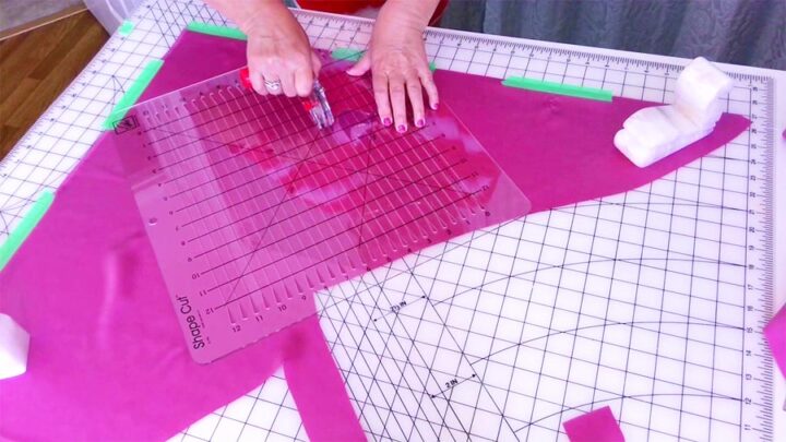 using a special ruler to cut fabric