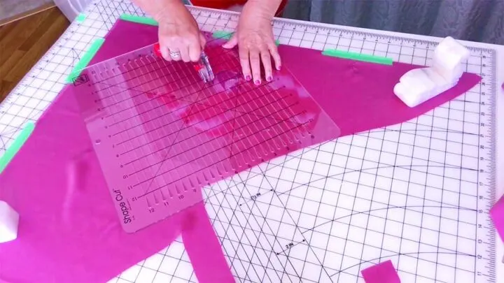 using a special ruler to cut fabric
