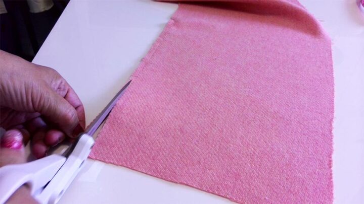 cutting the fabric by pulling a thread