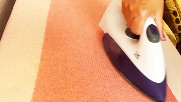 using steam iron to prepare wool flannel for the project