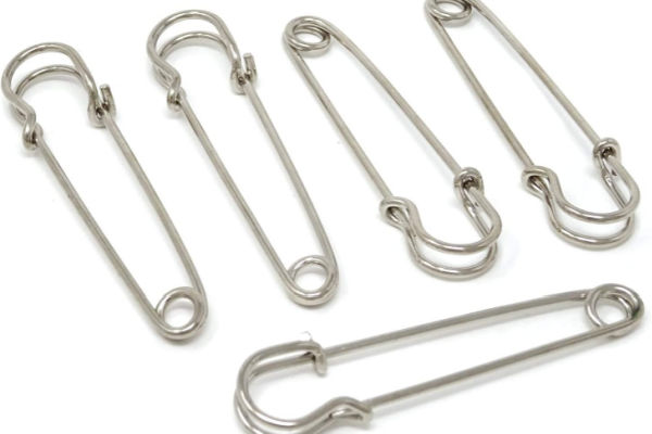 Safety pins for securing fabric