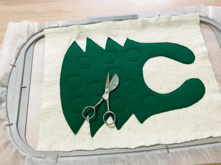 cut out the fabric in the hoop