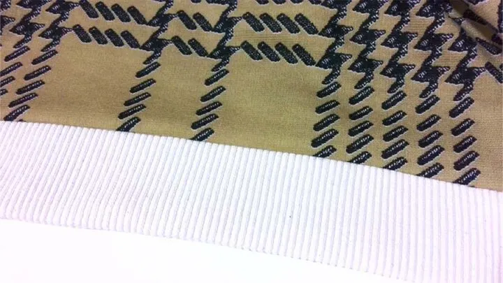 using fabric bands to hem knit fabric