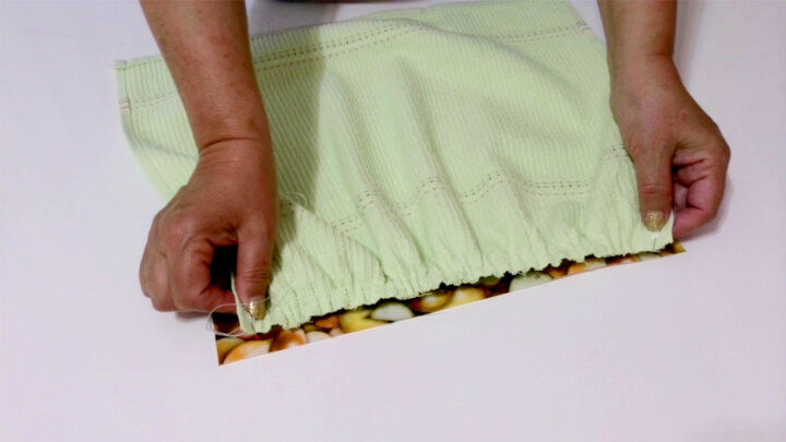 Gather the towel (by pulling the bobbin threads) and place the gathered edge on the fabric rectangle right sides together