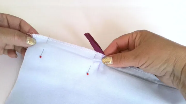 Push the zipper tail out of your way and pin the seam.