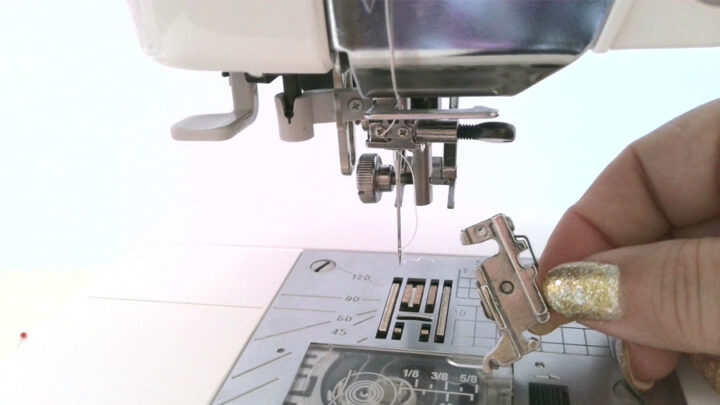 Grab your screwdriver and remove the presser foot holder (and screw) from your sewing machine. 