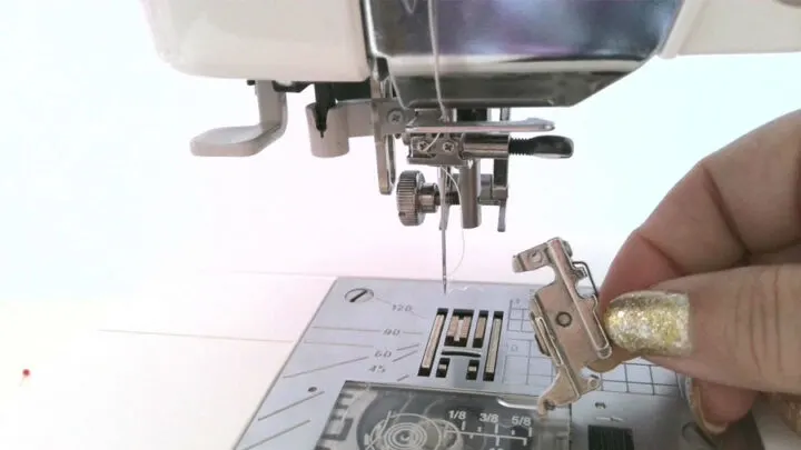Grab your screwdriver and remove the presser foot holder (and screw) from your sewing machine.