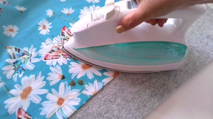 Set the iron to the appropriate heat for the fabric