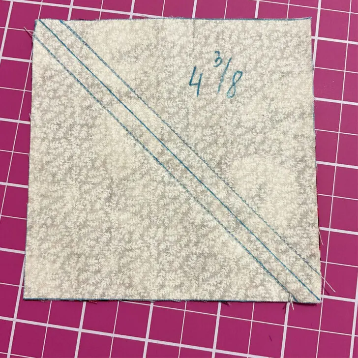 Pin the two pieces of fabric together and sew on the two stitching lines