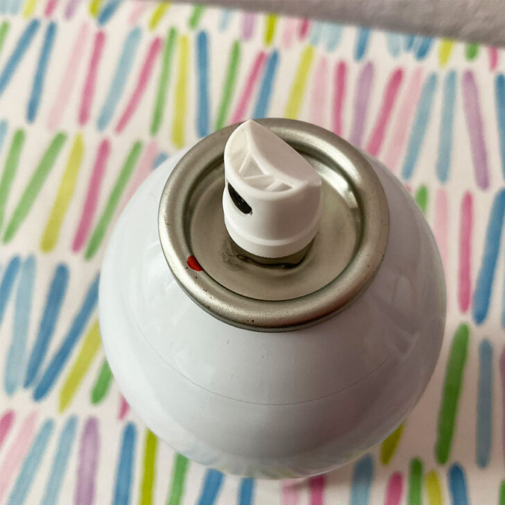 spray nozzle toward the red dot