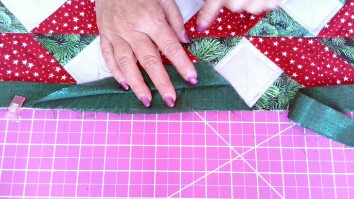 Cut one end of your binding strip at 45-degree angle