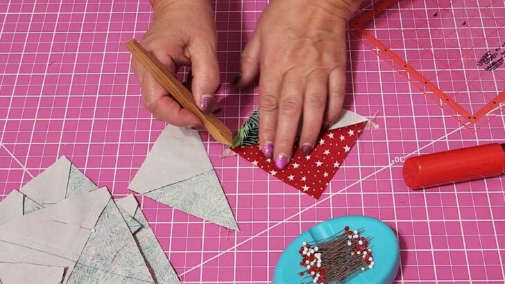 Fingerpress the seams toward the red fabric