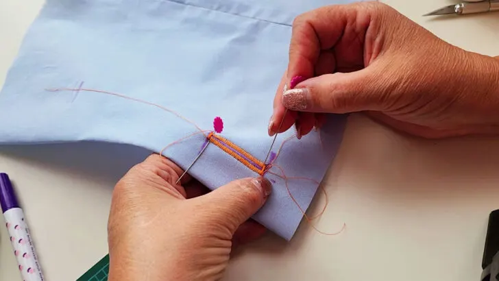 place a pin at each end of the buttonhole