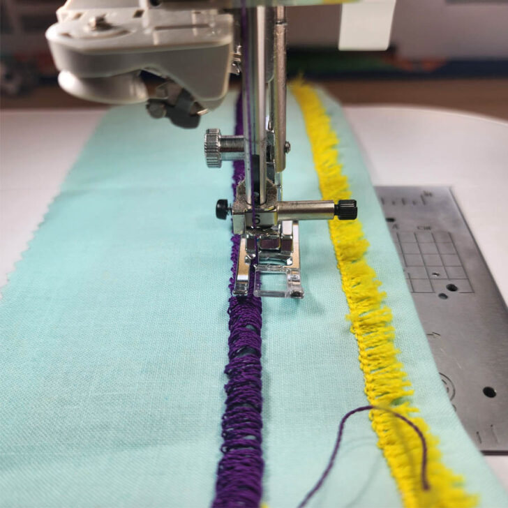 Sew the straight stitch along to the edge of the loops to secure the thread