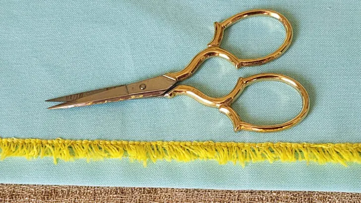 use small scissors to cut the loops on the other side