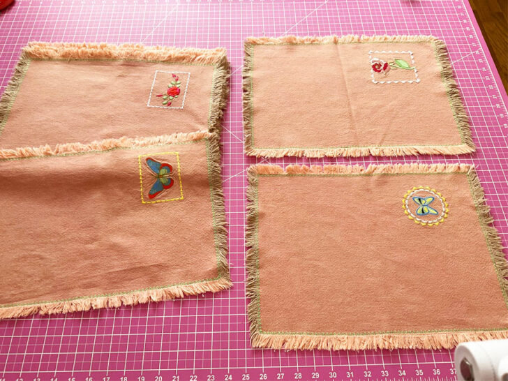 machine-embroidered napkins with frayed hems