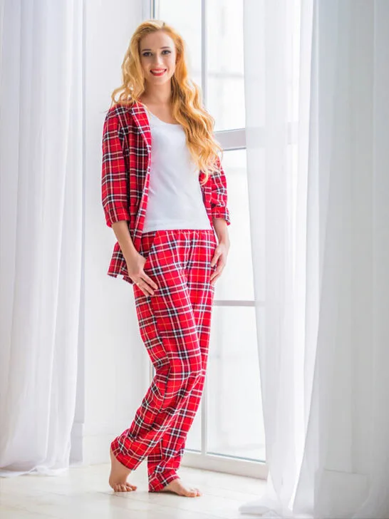 A woman in a pajama made from plaid flannel cotton fabric. 