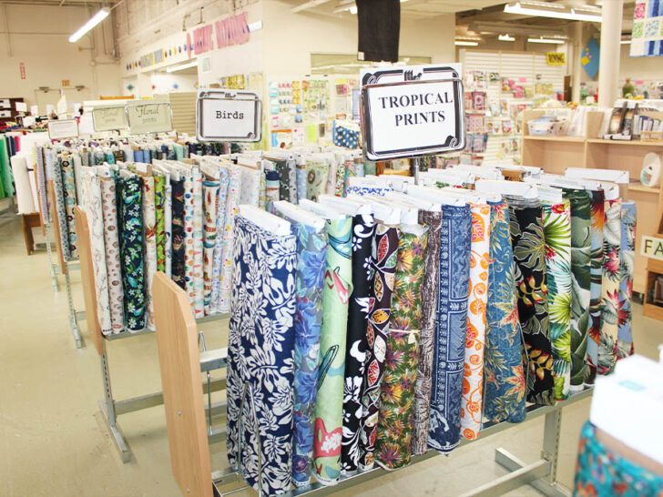 Bolts of quilting cotton fabric in a fabric store