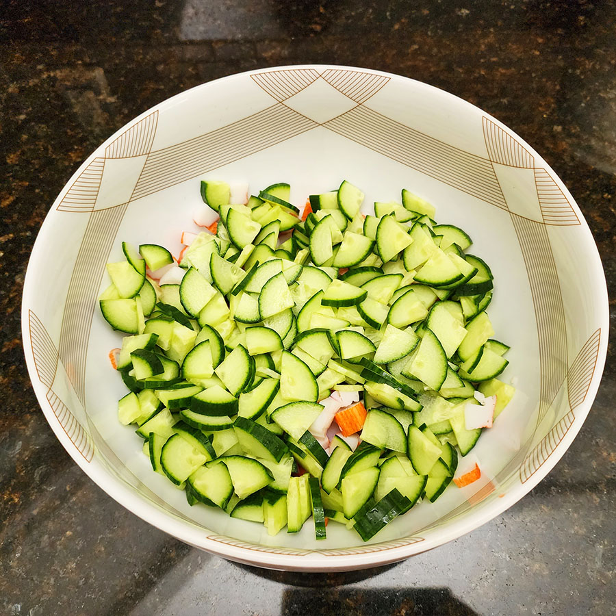 chopped cucumber on a bowl
