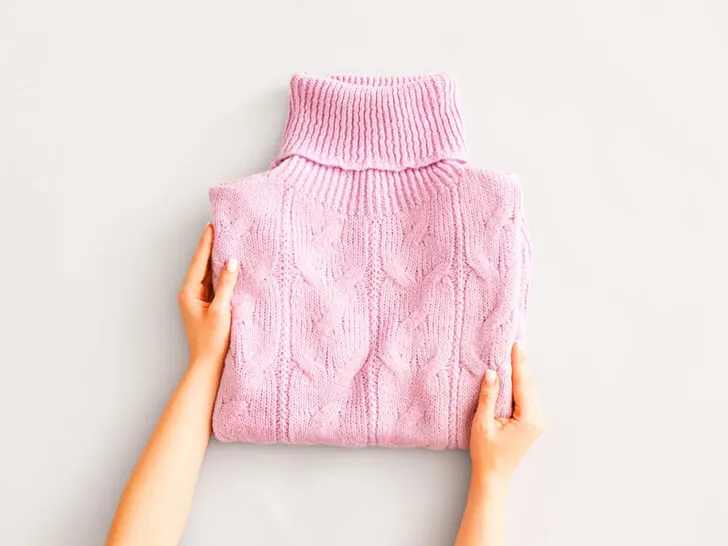 folded pink sweater