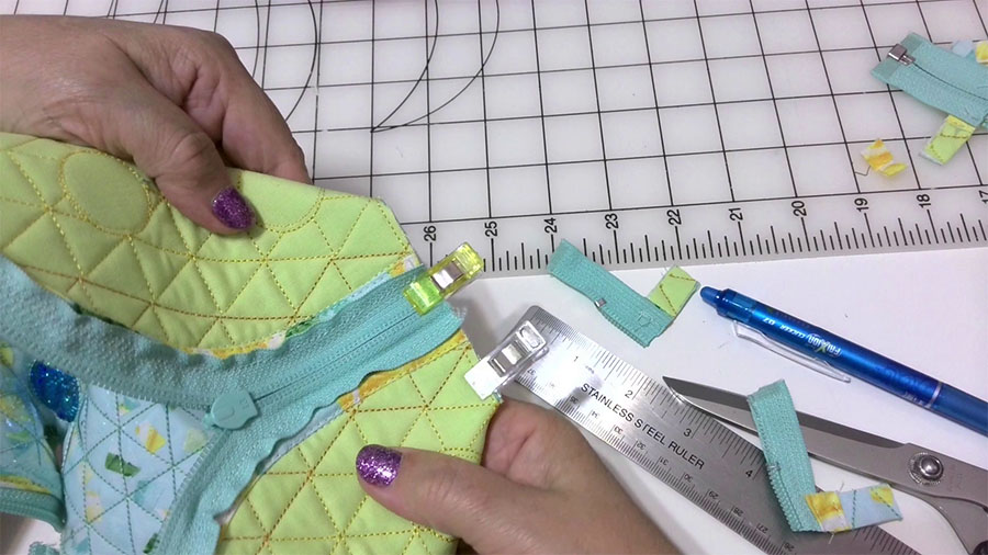 Turn the pouch wrong side out and fold it forming two corners