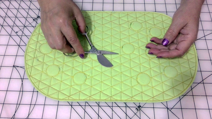 Use the duckbill embroidery scissors to cut thread tails