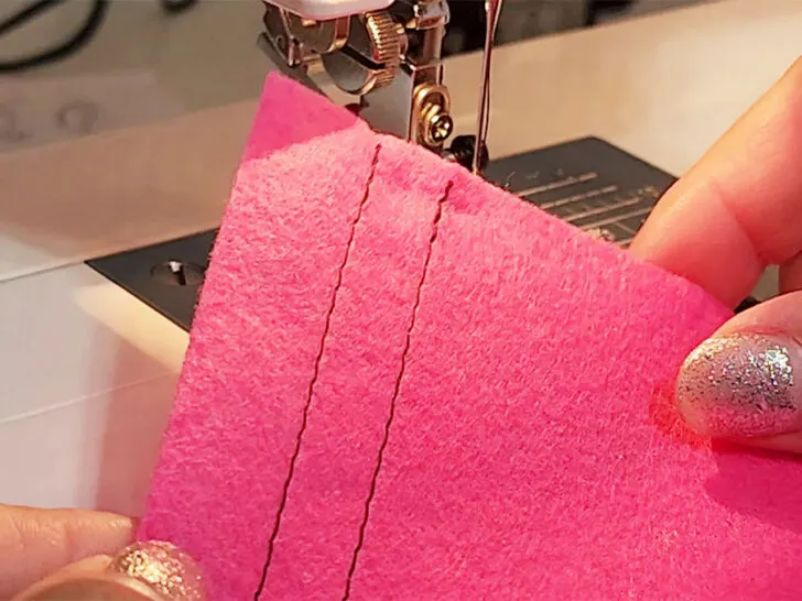 backstitching method for securing a seam on a sewing machine