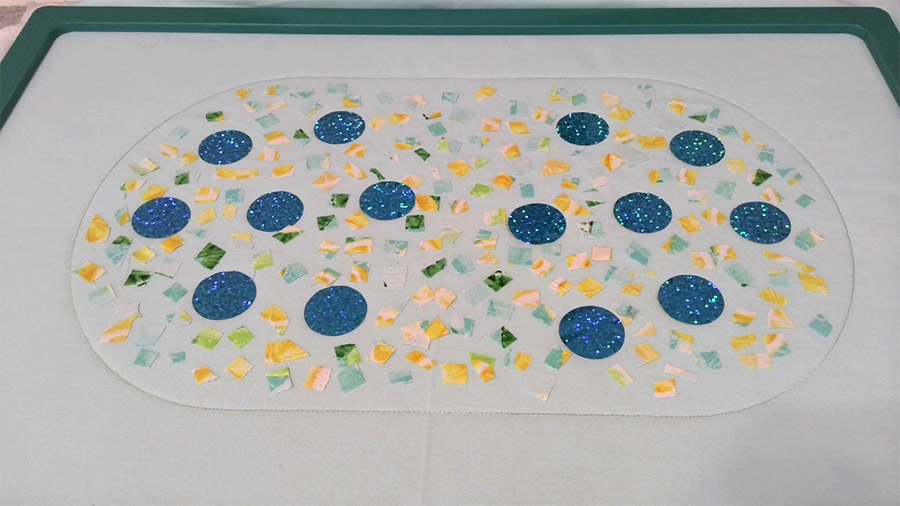 confetti pieces and holographic circles in fabric