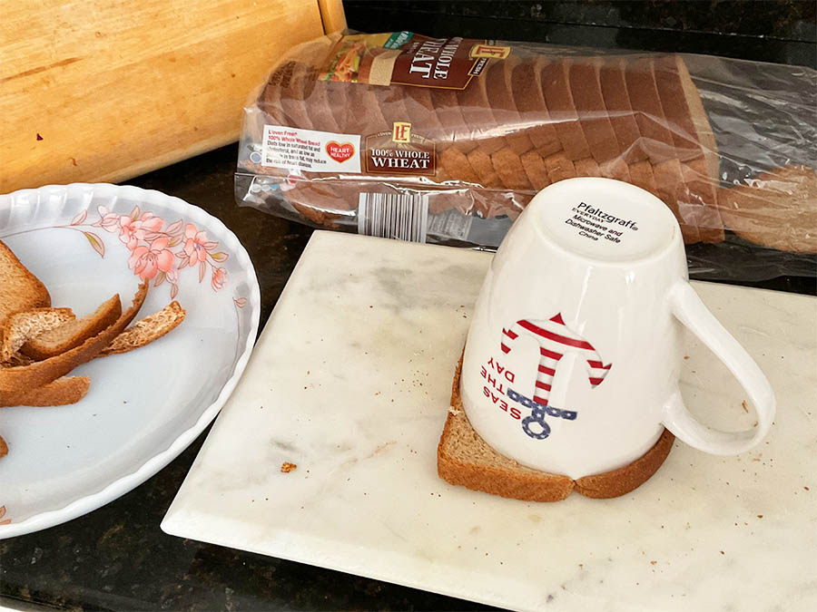 cut circular shapes from the sliced bread using mug