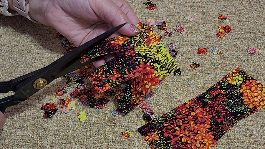 cutting fabric to make a confetti