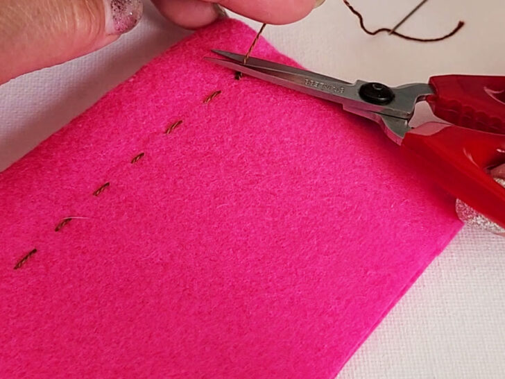 cutting the thread with scissors