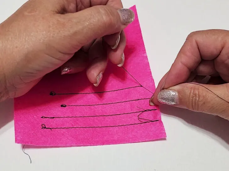 tying off thread tails by hand