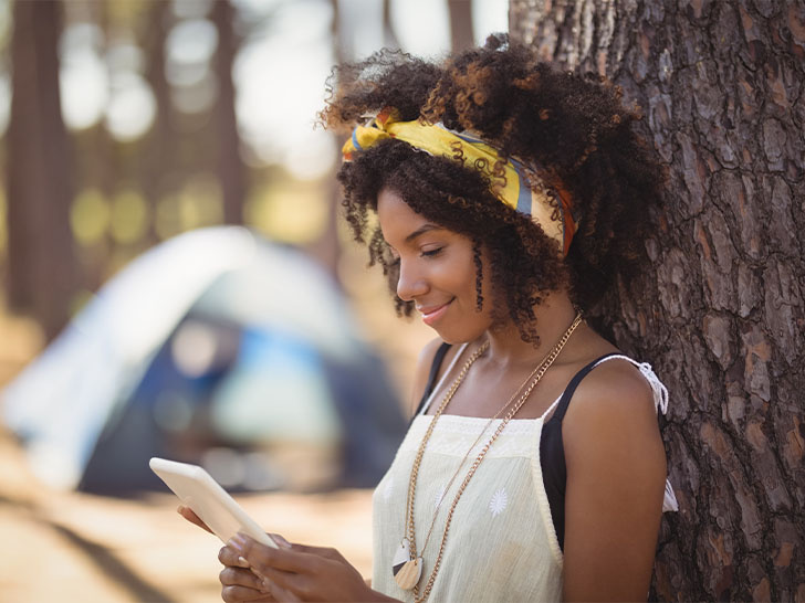 woman with curly hair wearing a headband