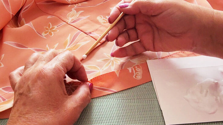 Run a thin line of fabric glue along the edge of the seam