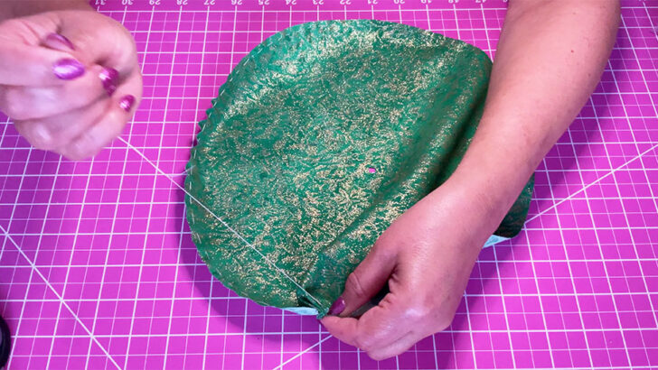 Sew a running stitch around the edge of each fabric circle
