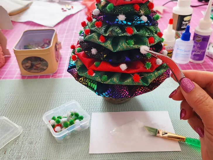 further decorate your yo-yo Christmas tree by sewing small beads, sequins, or other embellishments
