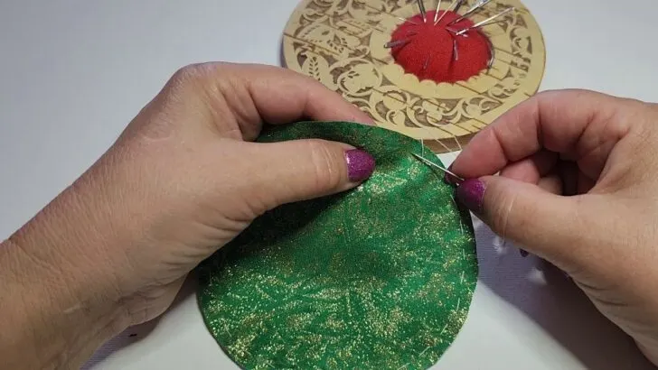 sewing a running stitch to make yo-yo