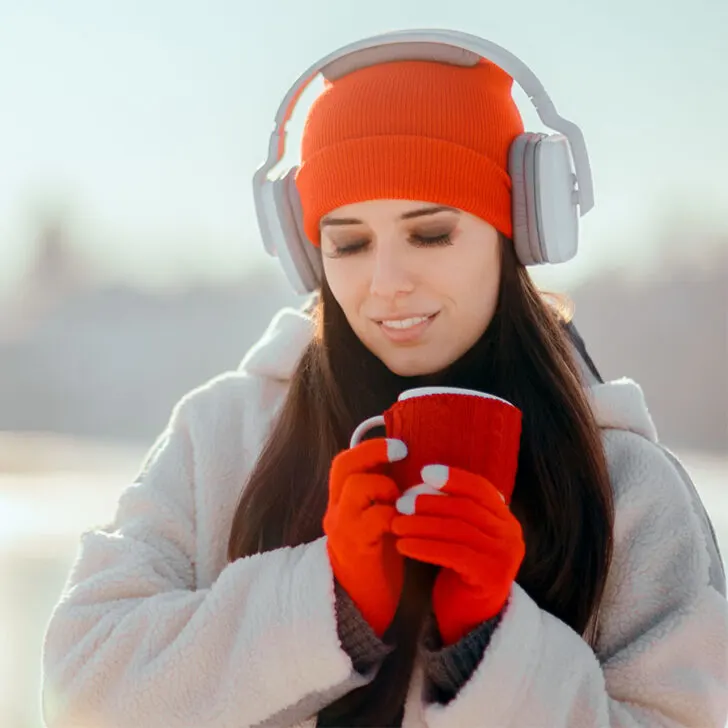 woman wearing a headphones and red beanie