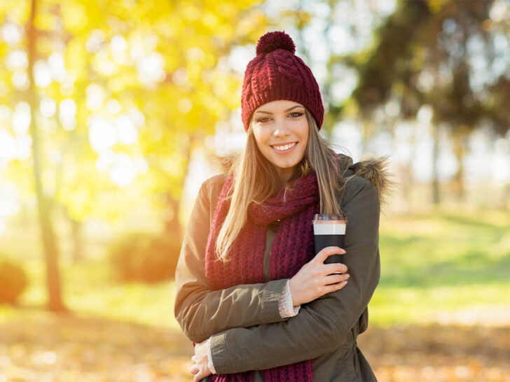 woman wearing a maroon beanie and scarf