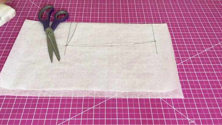 Fold the paper along the center line