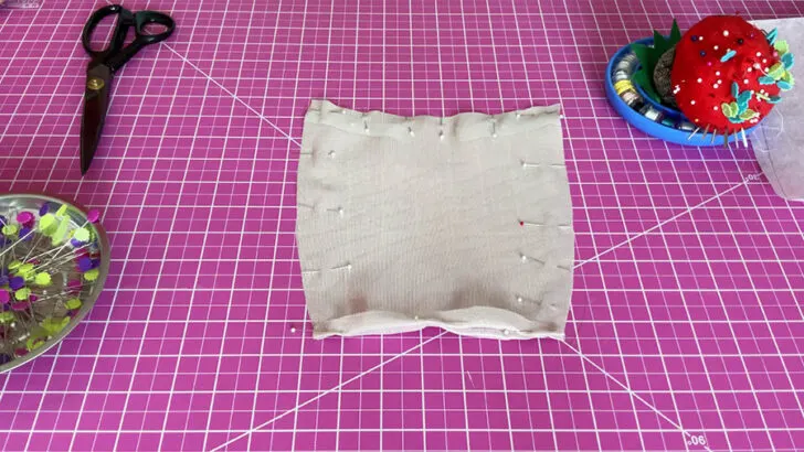 Pin around the edges to temporarily hold the layers together