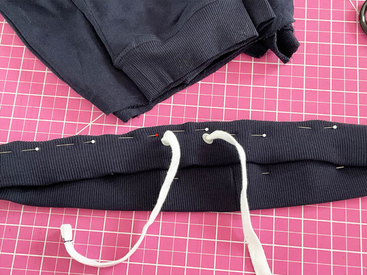 Take the original rib knit casing and wrap it around the enlarged elastic loop