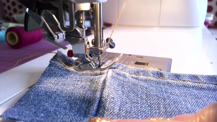 Begin sewing towards the thick seam at a steady pace