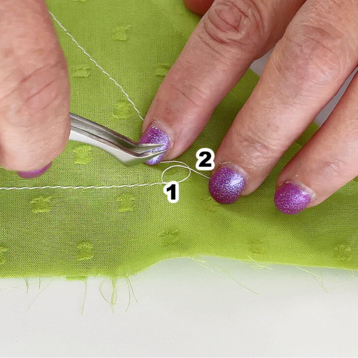 create a small loop close to the fabric