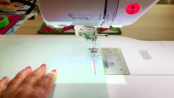 red laser aligns with the needle and the green laser marks the fabric edge
